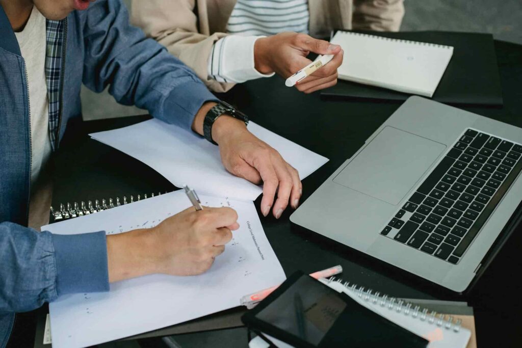 Two people working together at a table