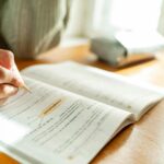 A woman doing exercises in a book