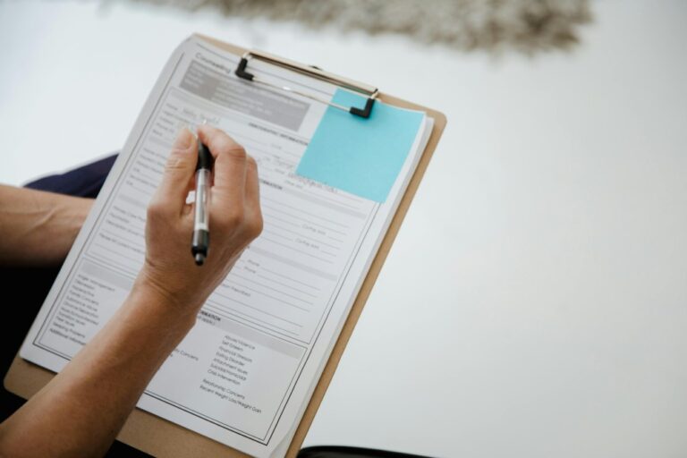 A person filling out an application form
